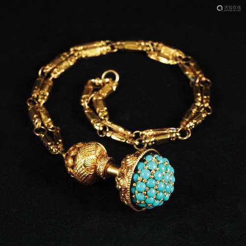 A 18kt. gold pendant with turquoise and diamonds