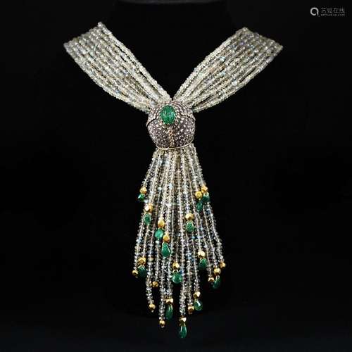 A silver and 18kt. gold necklace with diamonds, emeralds and...