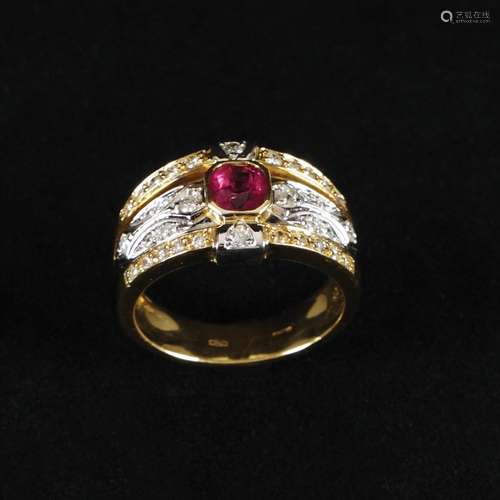 A 18kt. gold ring with diamonds and ruby