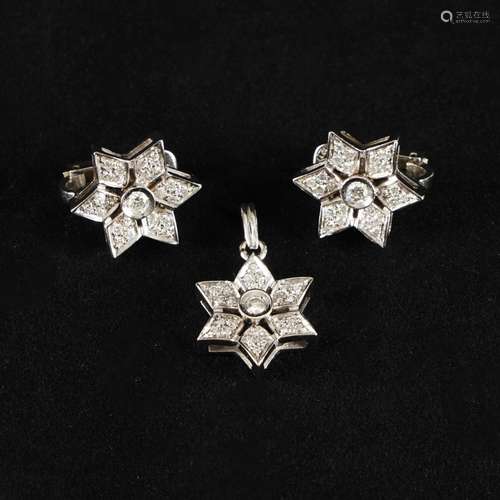 A pair of 18kt. gold star earrings and a pendant with diamon...