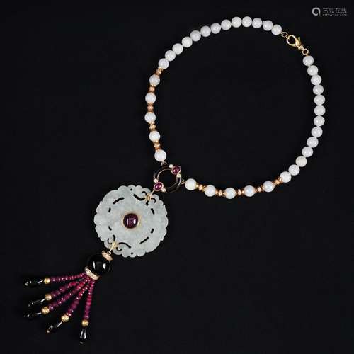 A 18kt. gold, jade, rubies, diamonds and onyx necklace