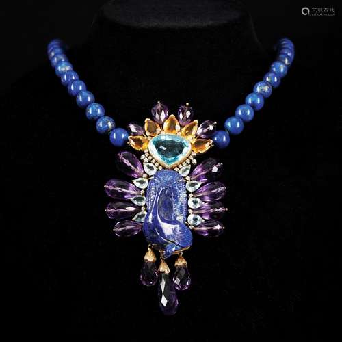 A peacock lapis pendant with topazes, aquamarines, amethysts...