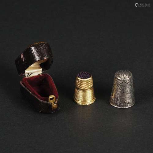 2 thimbles, one in 18kt. gold and one in silver