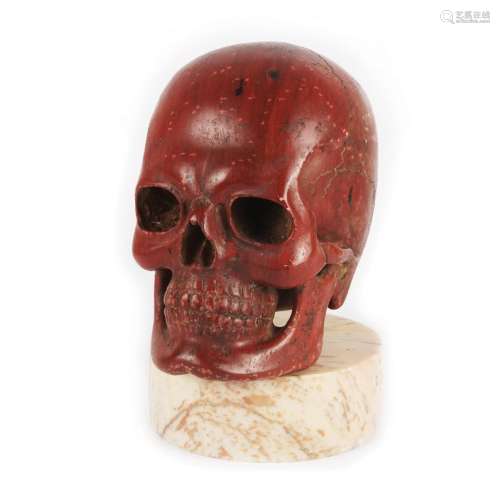 A Roman rosso antico marble skull, 19th century