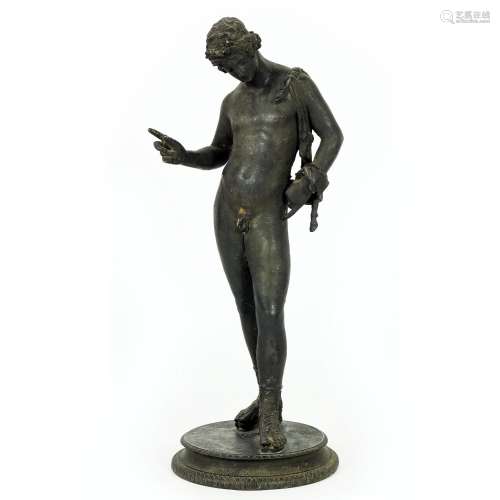 A patinated bronze figure of Narcissus after the antique
