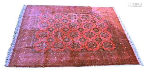 A GOOD PERSIAN CARPET, red ground with a design of large flo...