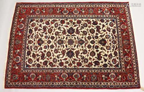 A GOOD PERSIAN ISFAHAN RUG, central cream ground panel with ...