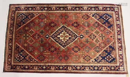 A PERSIAN JOSHAQAN RUG, pink ground with allover floral deco...