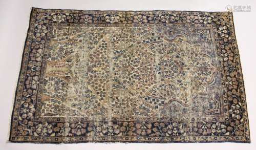 A PERSIAN KERMAN CARPET, cream ground with stylised tree des...