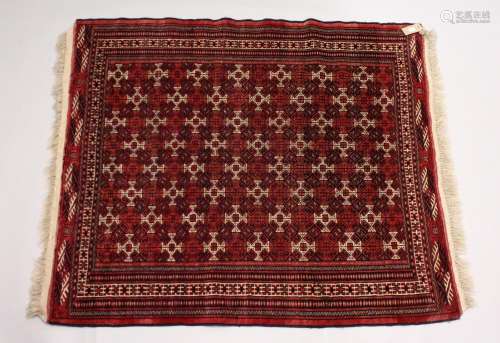 A TURKOMAN YAMUD CARPET, red ground with allover geometric d...