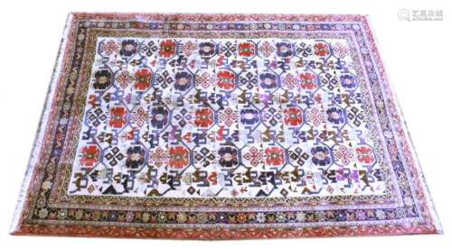 A PERSIAN CARPET, beige ground with allover stylised medalli...