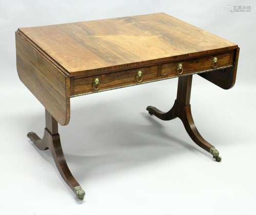 A REGENCY ROSEWOOD SOFA TABLE, of rounded rectangular form, ...