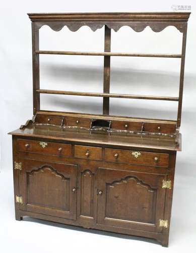 A GOOD 18TH CENTURY OAK DRESSER, the Delft rack with a mould...