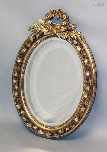 A GOOD FRENCH STYLE GILTWOOD OVAL MIRROR. 3ft 2ins x 2ft.