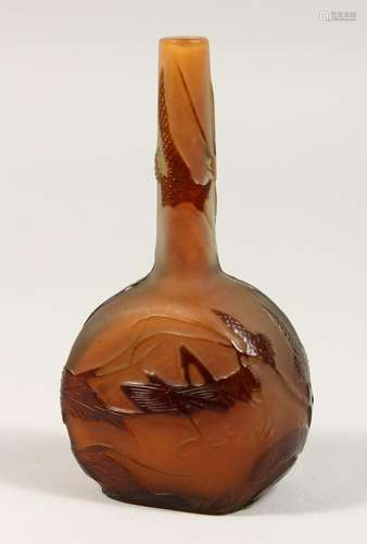 A SMALL AMBER GLASS BOTTLE, etched with a locust and flowers...