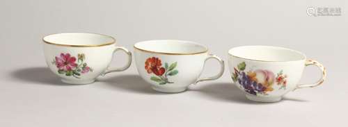 THREE 19TH CENTURY BERLIN CUPS painted with flowers. Sceptre...