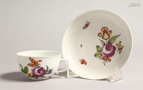 A 19TH CENTURY VIENNA COFFEE CUP AND SAUCER painted with flo...