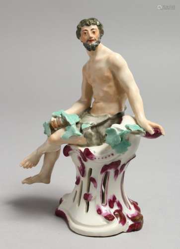 AN 18TH CENTURY VIENNA FIGURE of a scantily dressed man seat...