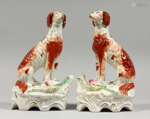 A GOOD PAIR OF STAFFORDSHIRE GAME DOGS with open legs, proba...