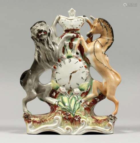 A STAFFORDSHIRE CLOCK GROUP with lions and unicorns 9ins