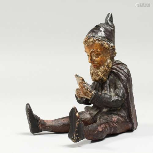 A 19TH CENTURY AUSTRIAN POTTERY SEATED PIXIE. 6ins high