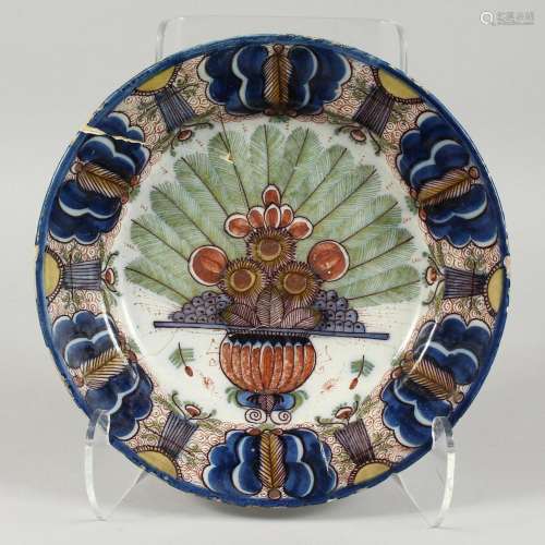 A LARGE DELFT TIN GLAZED CIRCULAR PLATE with flowers 12ins d...