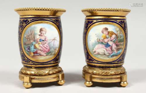 A GOOD SMALL PAIR OF SEVRES PORCELAIN ORMOLU MOUNTED POTS, r...