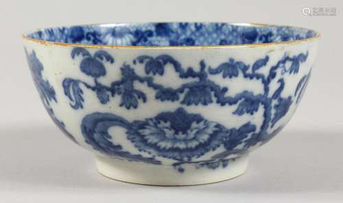 A 19TH CENTURY BLUE AND WHITE BOWL, painted with an urn of f...