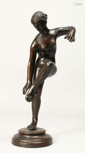 THE ANTIQUE A BRONZE FIGURE OF A STANDING NUDE on one leg, o...