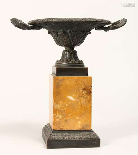 A REGENCY BRONZE TWO HANDLED CIRCULAR TAZZA on a marble plin...