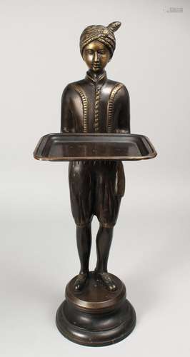 A CAST BRONZE FIGURE OF A STANDING MALE, his arms outstretch...