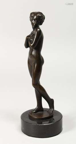 A GOOD BRONZE STANDING NUDE OF A YOUNG GIRL on a circular ma...