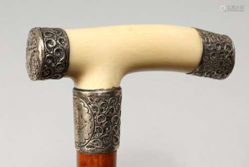 A VICTORIAN IVORY AND SILVER HANDLED WALKING STICK. London 1...