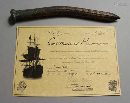 A HISTORICAL BRASS BOLT, 9.5ins long, removed from HMS Victo...