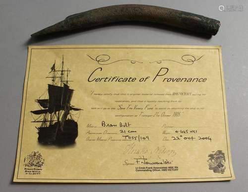 A HISTORICAL BRASS BOLT, 8.5ins long, removed from HMS Victo...