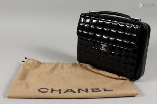 A USED CHANEL BLACK LAMINATED BAG. No. 738143, in a dust bag...