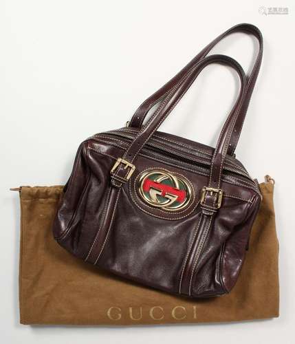 A GUCCI SOFT BROWN LEATHER HANDBAG. No. 17009 204990, in a d...