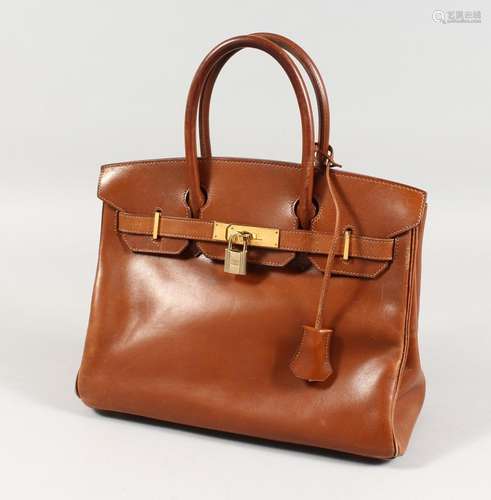 A BROWN LEATHER HANDBAG. 11ins x 10ins.