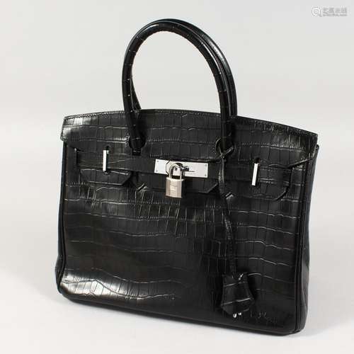 A BLACK LEATHER HANDBAG. 12ins x 9ins.