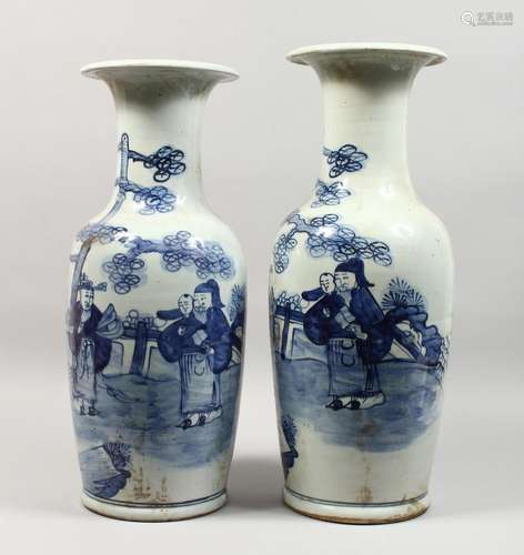 A TALL PAIR OF CHINESE BLUE AND WHITE VASES with figures.