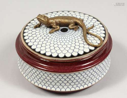 A PORCELAIN BOX AND COVER, the top with a bronze lizard. 5in...