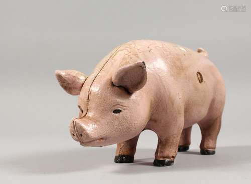 A CAST IRON PIG MONEY BOX. 7ins long.