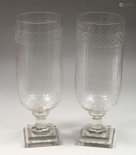 A PAIR OF CUT GLASS STORM LANTERNS. 17ins high.