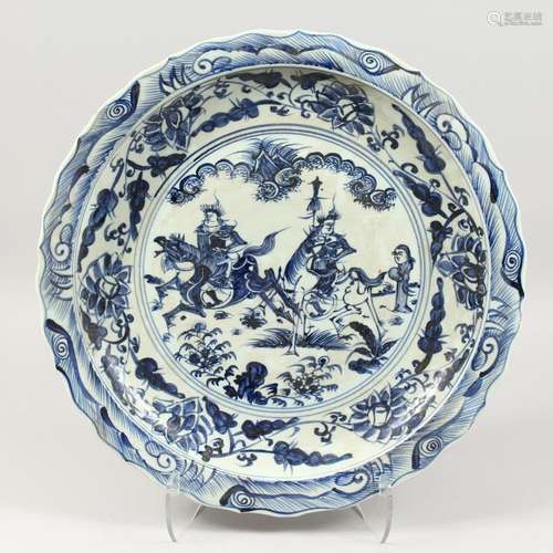 A LARGE CHINESE BLUE AND WHITE CHARGER with warriors. 19ins ...