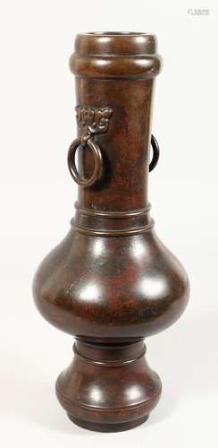 A CHINESE BRONZE VASE with ring handles. 16ins high.