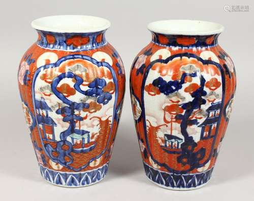 A PAIR OF IMARI VASES. 10ins high.