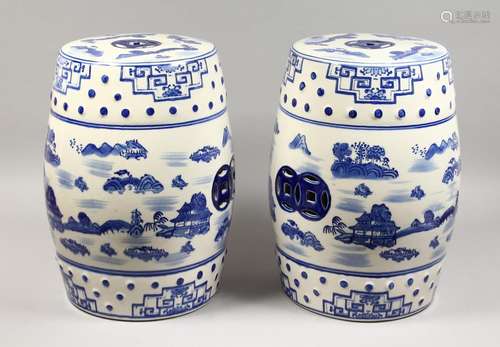 A PAIR OF CHINESE BLUE AND WHITE BARREL SEATS. 18ins high.