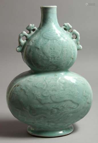 A CHINESE LIGHT BLUE DOUBLE GOURD VASE. Monogrammed in blue....