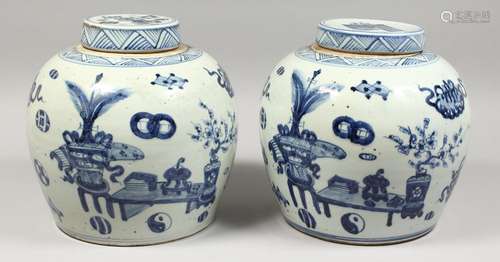 A PAIR OF CHINESE BLUE AND WHITE GINGER JARS AND COVERS. 11i...