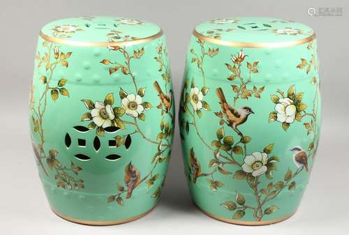 A PAIR OF GREEN CHINESE PORCELAIN BARREL SEATS with flowers ...